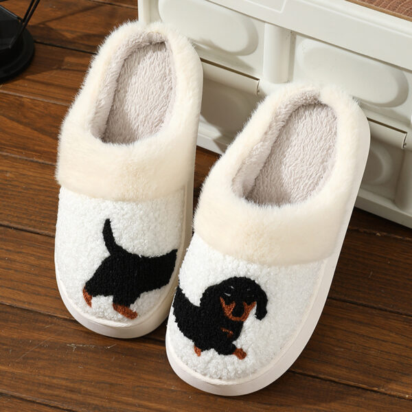 a pair of white slippers with a dog on it