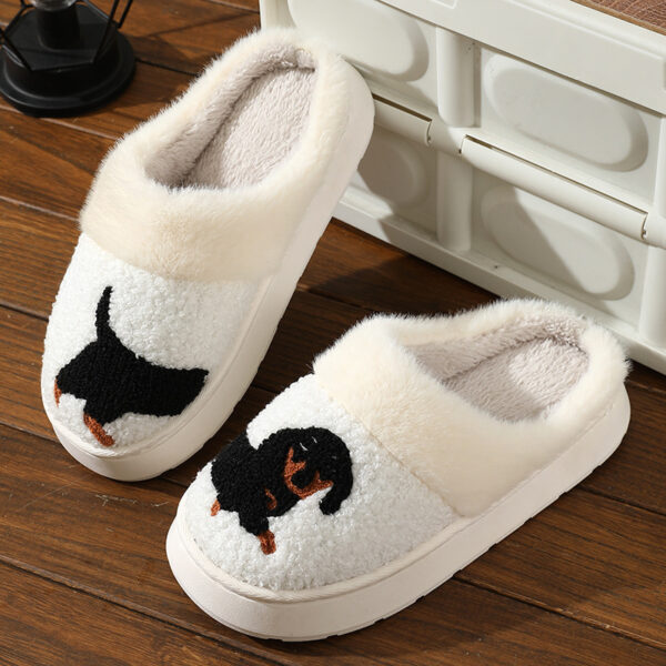 a pair of slippers with a dog on it